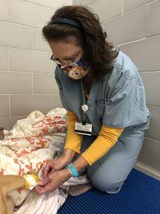 Donna Bloniasz taking care of a dog's leg in small animal wards
