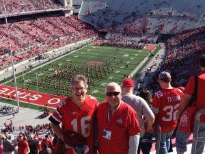 John Rush and Jim Ross at Ohio State football game wearing Ohio State football jerseys