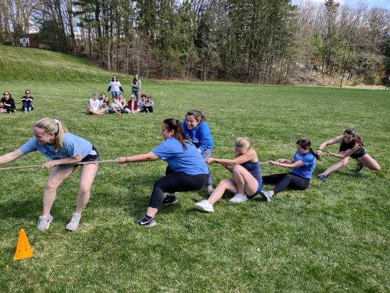 Students participate in a tug-of-war contest during the 2022 Vet Olympics, hosted annually by Alpha Psi each spring.