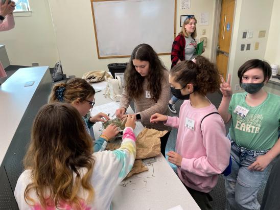 students learning how to care for animals in STEM class