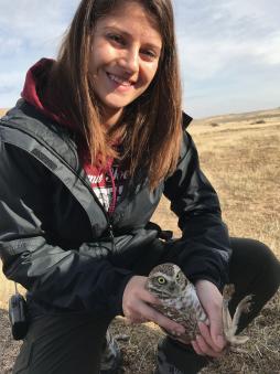 Young woman with a burrowing owl.