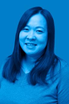 Dr. Yuki Nakayama with a blue filtered background.