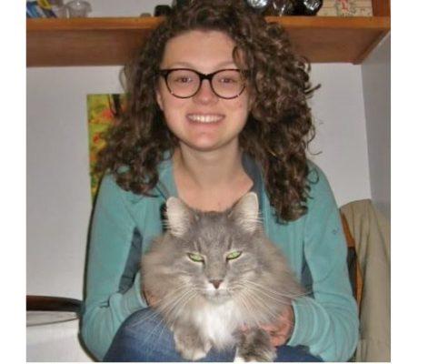 Alumni Mikhala Kaseweter with a cat