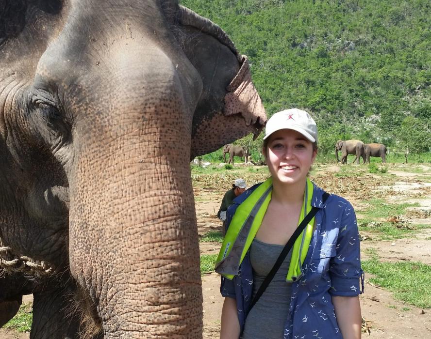 Alumni Jillian Morrell next to an elephant