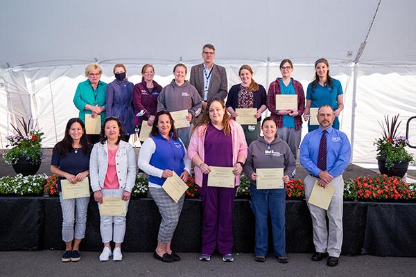 Cummings staff who are receiving awards pose for a picture