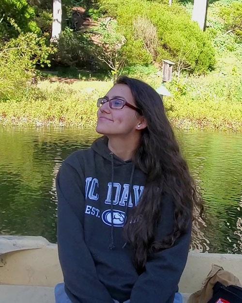 Imara Ortiz-Donate sitting on a boat in the lake