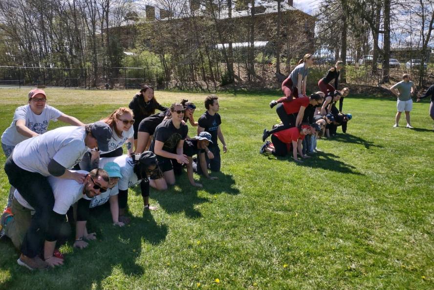 Students participate in a human pyramid construction contest during the 2022 Vet Olympics, hosted annually by Alpha Psi each spring