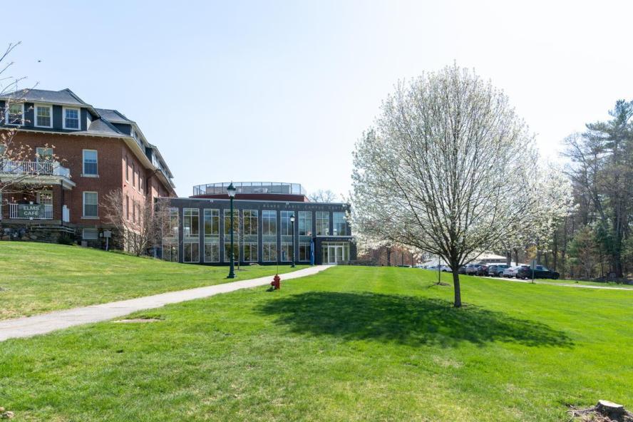 Agnes Varis auditorium and campus center in spring.