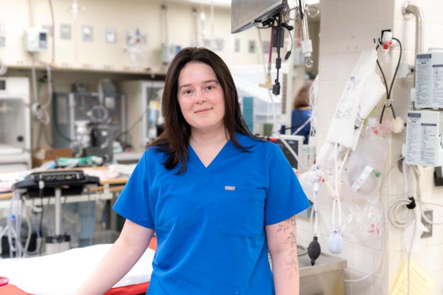 Person in medical scrubs standing in a Veterinary Hospital’s Intensive Care Unit.