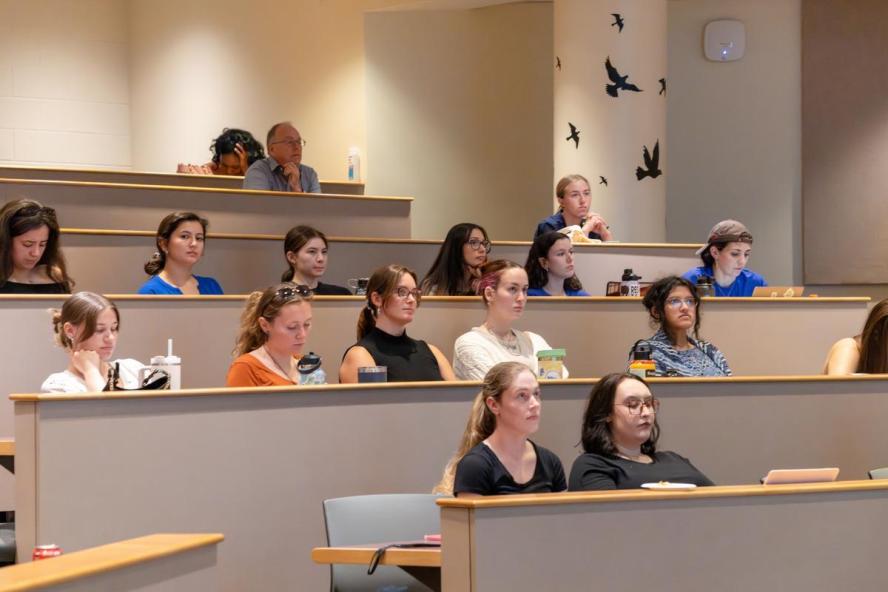 students sitting around a lecture hall