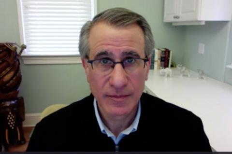 Tufts president Anthony Monaco speaking on Zoom Town Hall from his home.