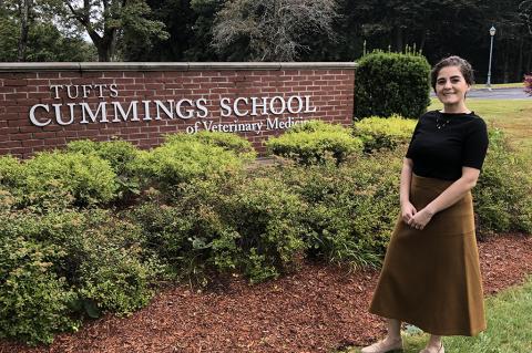 Elena Iacono Standing in front of the Cummings School sign.