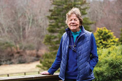 Judith Cook, a supporter of the Tufts Wildlife Clinic at the Tufts University School of Veterinary Medicine, poses for a portrait outside her home