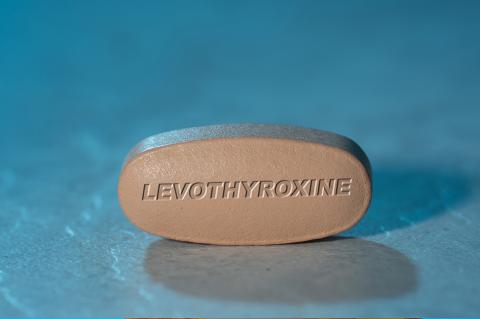 Levothyroxine drug Pill Medication ob blue background