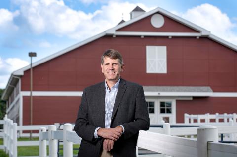 Dean Alastair Cribb in front of Cummings School’s Equine Sports Medicine Complex.
