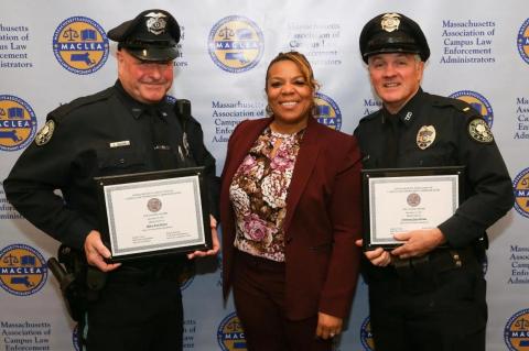 Brett Morava, Yolanda Smith, and Glenn McCune, with an award plaque. Responding to an injured cardiac arrest victim in Grafton, Tufts police officers Brett Morava and Glenn McCune used a defibrillator to bring his heart back to life
